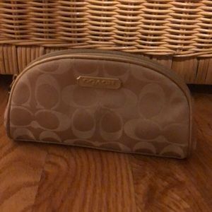 Gold coach makeup bag